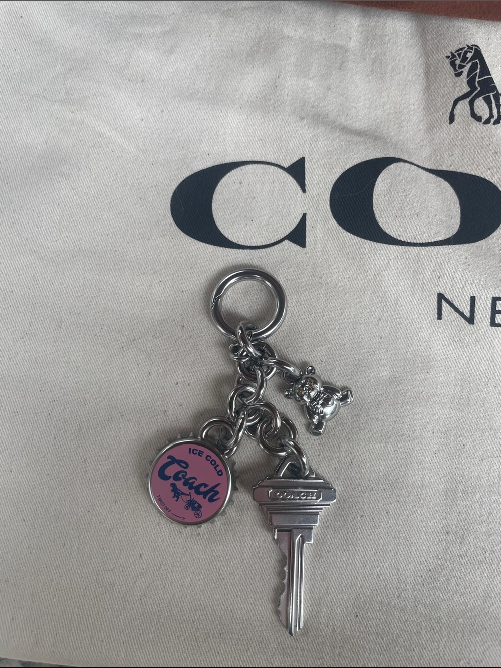Coach Silver-Tone Keychain with Pink 'Peach' Round Charm
